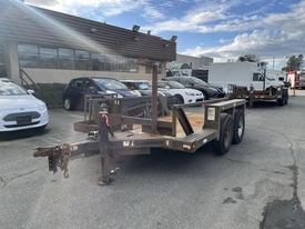 A 2013 JLG Industries Flat Deck Trailer with two axles and a metal frame designed for transporting equipment or heavy loads