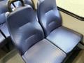 A pair of blue upholstered seats designed for a 2020 Chevrolet Express with a textured surface and ergonomic shape