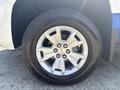 A close-up of the wheel and tire of a 2017 Chevrolet Colorado showing a silver alloy rim with five spokes and a black radial tire