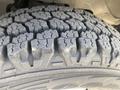 Close-up of a worn tire tread showing distinct patterns and grooves on a 2011 Chevrolet Express