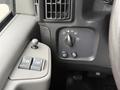 Control panel of a 2004 Chevrolet Express showing light settings window controls and air vents