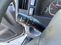 Steering wheel controls of a 2022 Isuzu NQR featuring turn signal, headlight, and cruise control functions