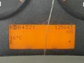 Dashboard display of a 2011 International 7500 showing mileage 125643 KM current temperature 16°C and gear position RN 4321