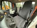Interior of a 2016 Freightliner 108SD showing a driver's seat and control panel with various levers and buttons