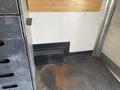 A 2008 Wells Industries Inc EW1422 with a flat floor and storage compartments on one side