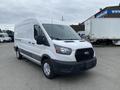 A white 2024 Ford Transit van with a wide cargo area and black accents on the front grille and bumpers