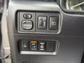 Dashboard controls of a 2021 Toyota 4Runner featuring buttons for mirror adjustment fog lights and power outlets