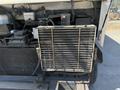 Close-up of the front radiator of a 2009 Workhorse W62 showing metal fins and surrounding components