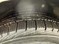Close-up of a tire tread from a 2017 Ford Transit Connect showing deep grooves and patterns designed for traction on various surfaces