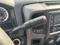 Close-up of the gear shift lever of a 2013 RAM 5500 featuring buttons for gear selection