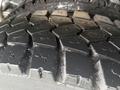 Close-up of a tire tread from a 2016 Freightliner 108SD showing deep grooves designed for traction and stability on various surfaces
