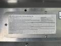 A close-up view of a metal plate displaying operating tips for a 2017 Freightliner MT45 with detailed specifications and instructions in a dense text format