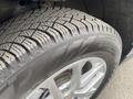 Close-up of a 2022 Chevrolet Equinox tire showcasing detailed tread patterns and the silver alloy wheel rim