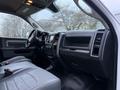 Interior of a 2018 RAM 5500 featuring gray leather seats and a dashboard with controls and display screen
