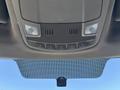 Interior view of a 2019 Ford F-550 ceiling with overhead lights and controls centered above the rearview mirror