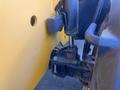 A close-up view of a 2013 JCB 510-56 Loadall showcasing its hydraulic lift cylinder and linkage system