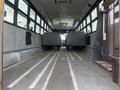 Interior view of a 2007 Freightliner B2 school bus showing rows of empty seats and a clear aisle leading to the front of the bus