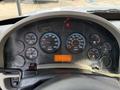 The dashboard of a 2012 International DuraStar 4300 featuring various gauges for RPM, speed, fuel, and other metrics