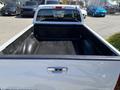 A 2011 Chevrolet Colorado truck with an open bed featuring a rubber liner for protection