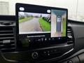 2023 Ford Transit dashboard display showing a rearview camera with guidelines and a top-down view of the vehicle