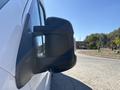 Close-up of the side mirror of a 2020 RAM ProMaster 3500 showing the mirror housing and reflective surface