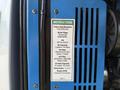 A label detailing engine specifications for a 2012 Genie Z 45/25 including oil type, capacities, air filter information, and operating instructions