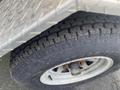 Close-up of a tire on a 2014 Express 8 Foot Trailer showing tread pattern and metal rim