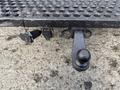 A trailer hitch attached to a 2014 Hino 195 with a connector and wiring visible on the side