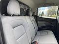 The interior of a 2018 Chevrolet Colorado featuring a gray fabric rear seat with headrests and armrests