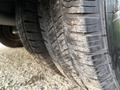 Close-up of a 2019 Chevrolet Express tire showing tread patterns and some dirt on the surface