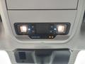 Interior overhead console of a 2023 Ford F-450 Super Duty featuring lights and controls for various functions