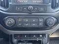 Dashboard controls of a 2017 Chevrolet Colorado featuring climate control buttons and audio interface