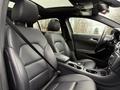 Interior of a 2016 Mercedes-Benz GLA-250 featuring leather seats with a sleek design and modern dashboard elements