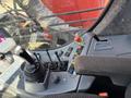 Control panel of a 2018 Sandvik Ranger DX800 featuring various levers buttons and a joystick for operation