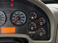 Dashboard of a 2012 International 7400 showing speedometer, fuel gauge, voltmeter, and air pressure gauges