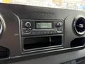 Dashboard of a 2022 Mercedes-Benz Sprinter featuring a control panel with a radio display and air conditioning vents