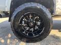 A close-up view of a black wheel and tire from a 2018 RAM 3500 featuring a distinctive tread pattern and the brand name Toyo Tires on the sidewall