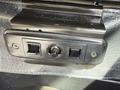 A close-up view of the control panel with two switches and a knob on a Chevrolet Express vehicle interior