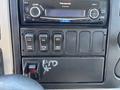 Dashboard controls of a 2011 International 4300 including a radio and several switches for various functions