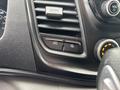 Close-up of the dashboard controls in a 2020 Ford Transit 250 featuring air vents and buttons for mode selection and headlights