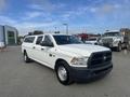 A white 2012 RAM 2500 pickup truck with a canopy on the bed parked with a plain exterior and black grille