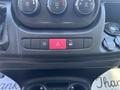 A control panel featuring various buttons including an emergency flash, traction control off, and a power outlet in a 2020 RAM ProMaster 3500