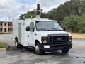 2017 Ford Econoline vehicle with utility features and a raised light mounted on top