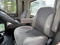 Two truck seats inside a 2008 Kenworth T370 with a driver's seat and a passenger seat both in gray fabric