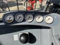 The control panel of a 2018 Sandvik Ranger DX800 featuring various gauges displaying pressure and temperature readings