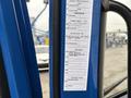 A blue 2017 Autocar Xpert with an exposed dashboard showing various labels and specifications related to the engine and chassis components