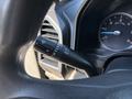 Close-up of a windshield wiper control stalk in a 2022 Ford F-350 SD showing the lever position and surrounding instrument panel elements