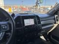 Interior view of a 2019 Ford F-550 showing the dashboard with touchscreen display and control buttons