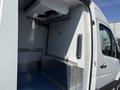 A 2016 Mercedes-Benz Sprinter van with an interior featuring a blue floor and metallic paneling along the walls and base, designed for cargo or refrigeration purposes