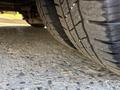 Close-up of two tires on a 2017 Chevrolet Express showing tread patterns and details of the rubber texture
